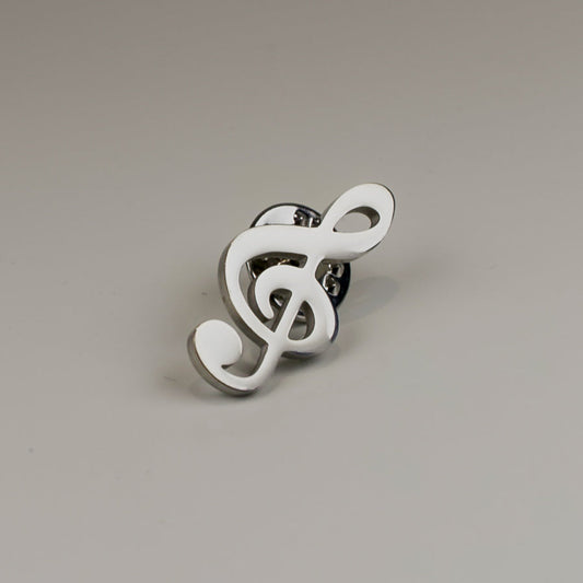 White treble clef-shaped ring on a gray background