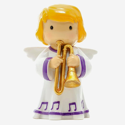 Toy angel figurine with a trumpet on a white background