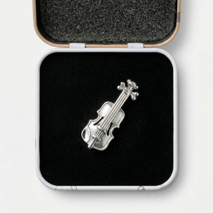 Violin lapel pin with premium black gift box on dark background