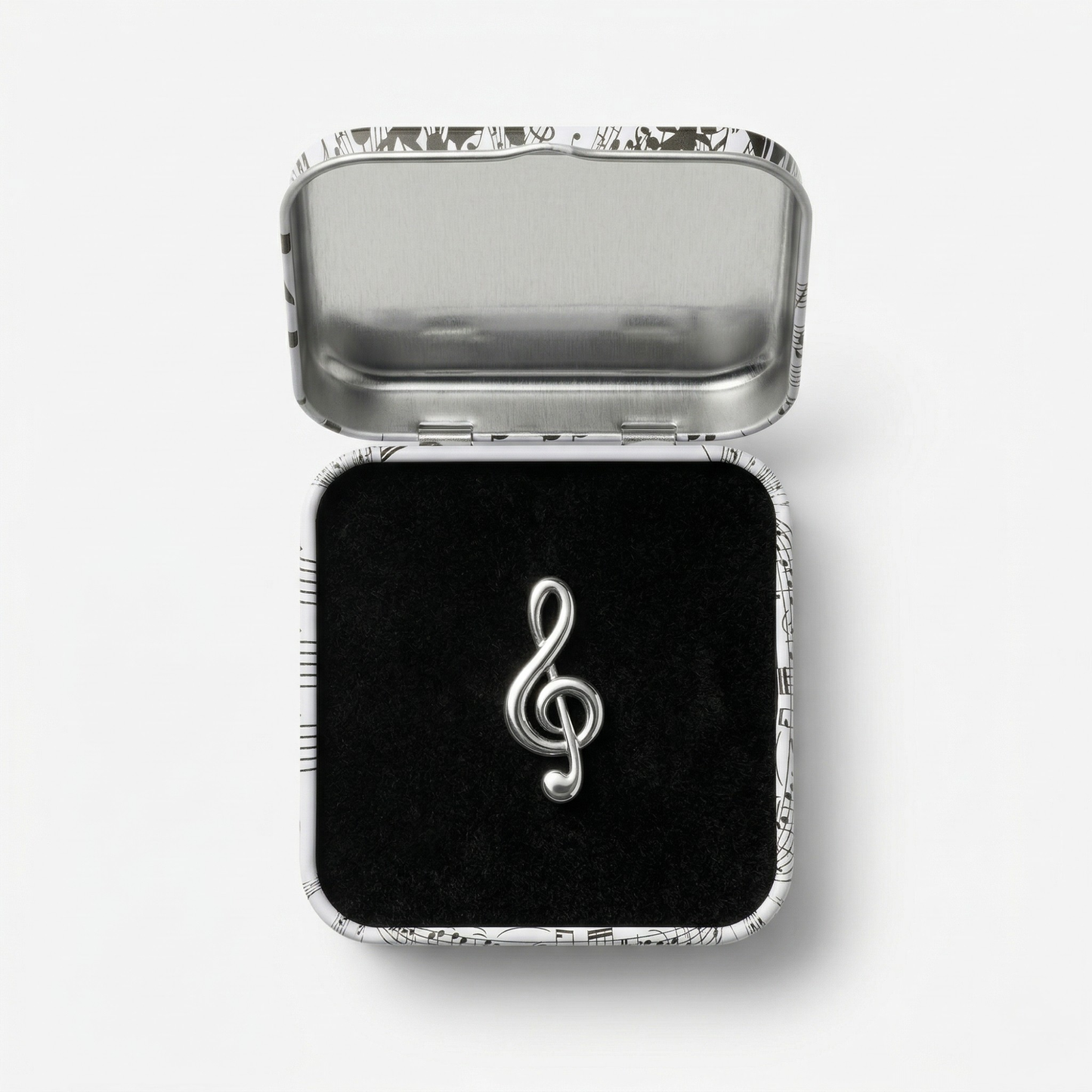 Close-up of treble clef metal lapel pin showing clean musical symbol