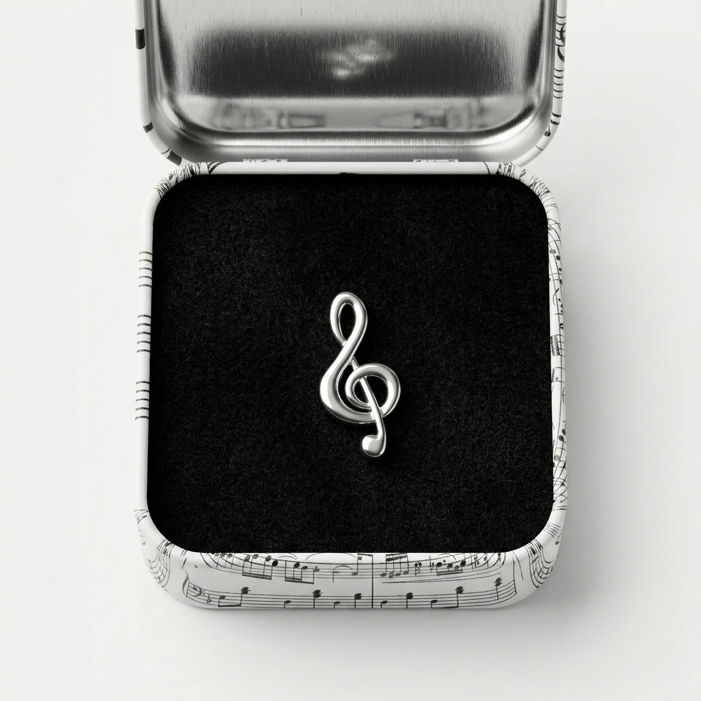 Treble clef lapel pin with premium black gift box on dark background