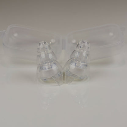 Clear plastic earbud cases on a light gray background