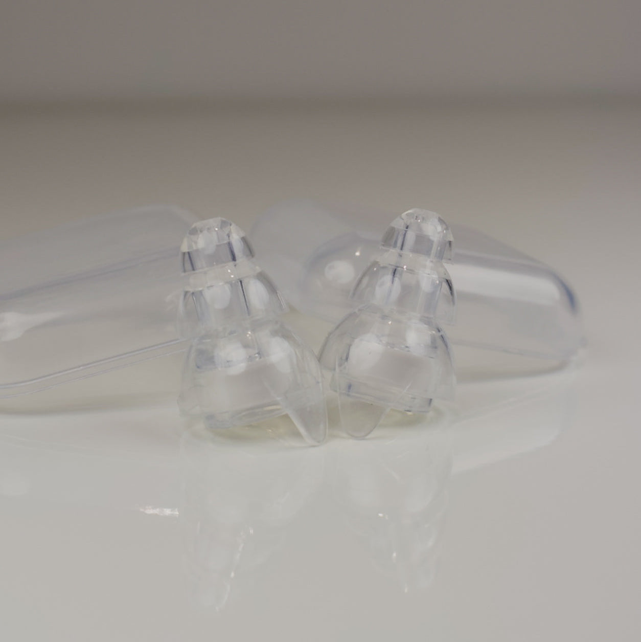 Clear plastic components on a white background