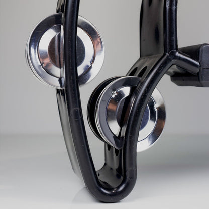 Close-up of a Black tambourine on a gray background